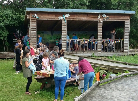 People enjoying an event at Severn Farm Pond copyright Montgomeryshire Wildlife Trust
