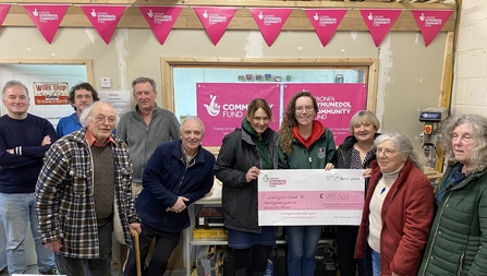 Montgomeryshire Wildlife Trust and Llanfyllin Shed receive a big cheque for £10,000 from the National Lottery