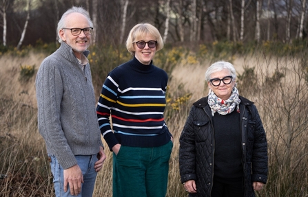 Three trustees standing together at Cors Dyfi Nature Reserve